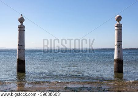 Columns Pier Cais Das Colunas At River Tejo Banks In Lisbon, Portugal