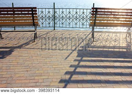 Bench On The Lake In The Park Zone. Social Distansing During Pandemic. Empty Park During Covid-19 Qu
