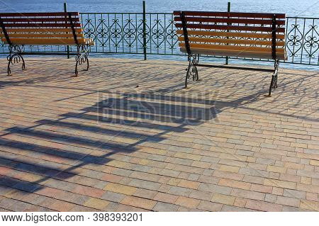 Bench On The Lake In The Park Zone. Social Distansing During Pandemic. Empty Park During Covid-19 Qu