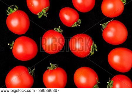 Fresh Cherry Tomatoes Isolated On A Black Background. Top View , Layout