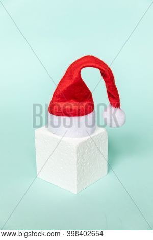 Simply Minimal Composition Winter Object Santa Hat And Cube Shapes Geometric Form Podium Isolated Bl