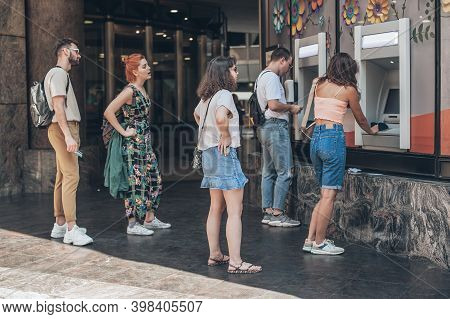 Line To Atm. Group Of People Waiting To Withdraw Money