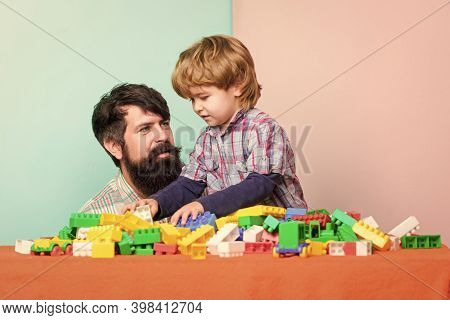 Little Boy With Bearded Man Dad Playing Together. Father And Son Play Game. Child Development. Happy