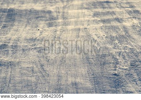 Tire Tracks Left In The Snow On A Bright Sunny Day. The Concept Of Snow Removal, Ski Resorts, Active
