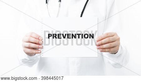 Doctor Holding A Card With Text Prevention,medical Concept