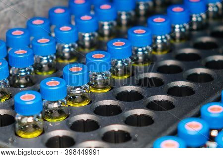 Hplc Glass Vials In The Rack. Research And Development Of Pharmaceuticals And Vaccines. High Perform