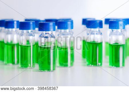 Hplc Vials With Green Sample Of Plant Extracts. Developing Of Drugs Based On Natural Products. Bioch