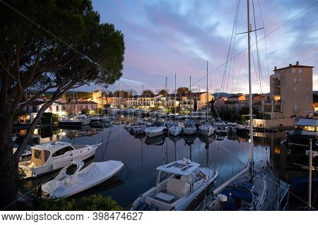 View On Houses, Roofs, Canals And Boats In Port Grimaud, Var, Provence, France During Sunset