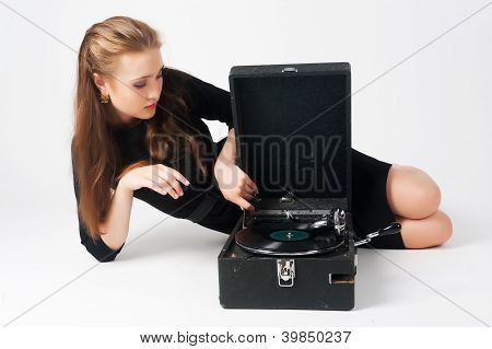Pretty woman with gramophone