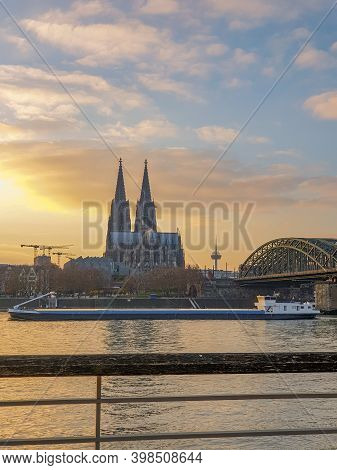 Cologne Germany November 2020, Alongside The Rhein River During Sunset With The Huge Cathedral In Ko