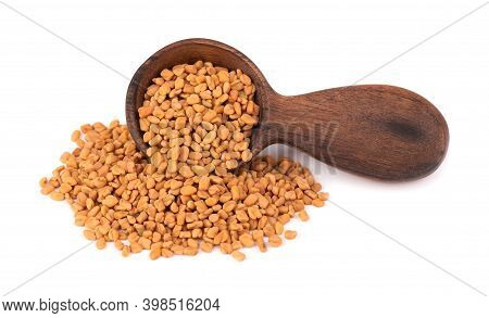 Fenugreek Seeds In Wooden Spoon, Isolated On White Background. Shambala, Helba Seeds.
