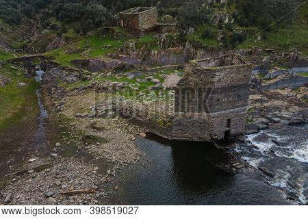 Mill Tower And Other Ancient Ruins On The Bank Of The Alagon River.