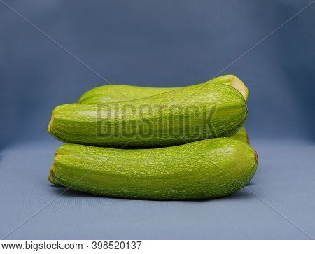 Ripe Zucchini On A Blue Background. Levitation. Isolated. To Close.