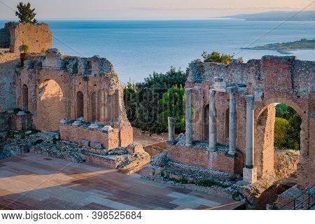 Taormina Sicily, Sunset At The Ruins Of The Ancient Greek Theater In Taormina, Sicily Italy