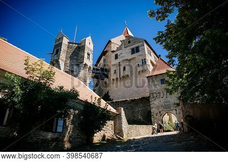 Gothic Imposing Historic Castle Pernstejn At Sunny Summer Day, Stronghold On Rock Above Village Of N