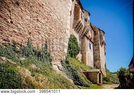 Gothic Imposing Historic Castle Pernstejn At Sunny Summer Day, Stronghold On Rock Above Village Of N
