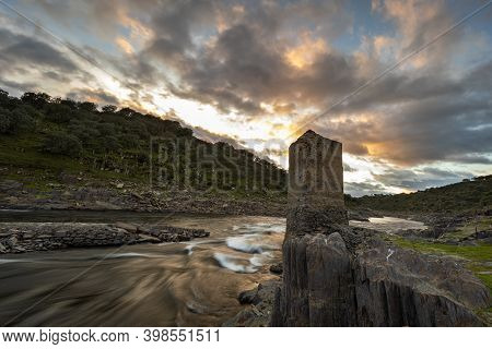 Sunset With Old Tower On The Bank Of The Alagon River. Spain.