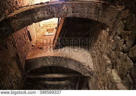 Detail Of Arches In The Town Of Panicale In Umbria, Italy. High Quality Photo