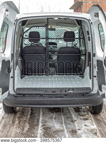 Empty Small Cargo Van With Partition Bulkhead Wire