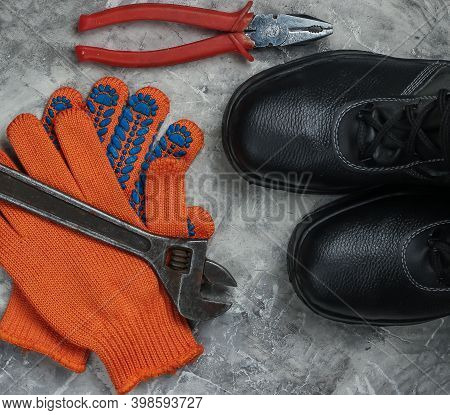 Flat Lay Composition With Different Industrial Working Tools And Instruments, Safety Equipmen On Gra