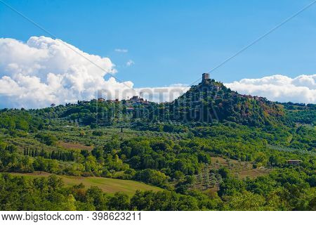 Bagno Vignoni, Italy - September 3rd 2020. The late summer landscape around Bagno Vignoni in in Val d\'Orcia, Siena Province, Tuscany, Italy.  Looking towards the hill village of Rocca d\'Orcia