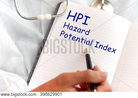 Doctor Holding A Card With Text Hpi Hazard Potential Index Medical Concept