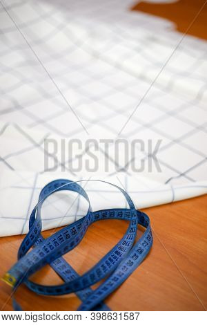Blue Soft Tape In The Foreground And Pieces Of White Cloth In The Background
