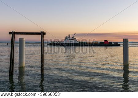Richmond, Canada - September 10, 2020: Seaspan Ferry On The Fraser River Sunset Time In British Colu
