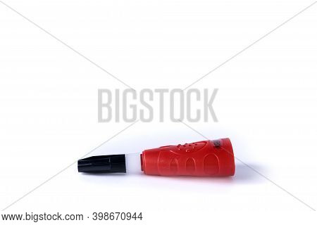 Side View Of A Bottle Of Quick Drying  Super Glue Laying Down