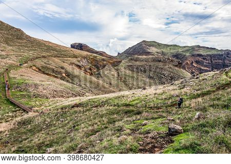 Girl Hiking Rocky Cliffs Clear Near Water Of Atlantic Ocean Bay Ponta De Sao Lourenco, The Island Of