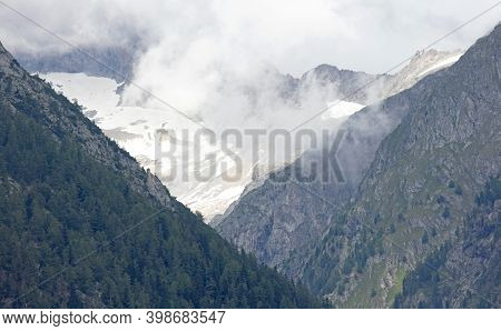 Snow On Mountaintop In Switserland, Snow In The Summertime