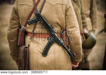 Re-enactor Dressed As Russian Soviet Infantry Soldier Of World War Ii With Sub-machine Gun Weapon. R