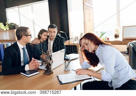 Oppressed Red-haired Woman Signs Document On Deprivation Of Guardianship.