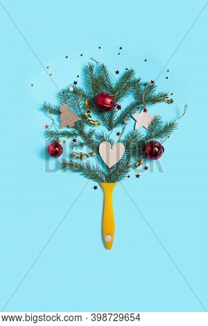 Creative Composition Christmas And New Year. Paint Brush With Christmas Fir And Ornaments On A Red B