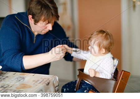 Father Feeding Baby Girl From Spoon Mashed Vegetables And Puree. Food, Child, Feeding And People Con
