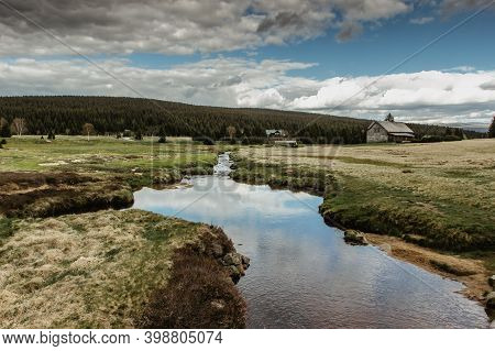 Fall Spring View Of Mountain Landscape, Fresh Cold Stream And Large Meadow At Jizerka Settlement,cze