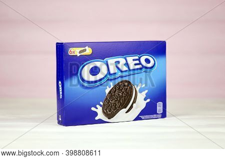 Oreo Blue Product Box On White And Light Blue Wooden Background. Oreo Is A Sandwich Cookie With A Sw