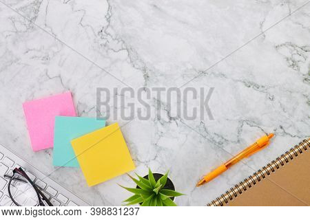 Modern Clean Flat Lay Or Top View Office Desk Or Office Table And Office Supplies As Stick Note Or N