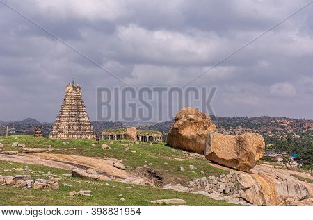 Hampi, Karnataka, India - November 4, 2013: Virupaksha Temple East Gopuram Under Gray Cloudscape, Wi
