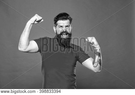 Strength And Drive. Bearded Man Show Strength. Strong Hipster Flex Arms Red Background. Strength And