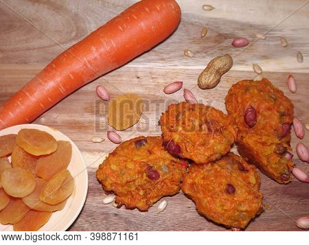 The Process Of Making Carrot Cookies With The Addition Of Dried Apricots, Peanuts And Sunflower Seed