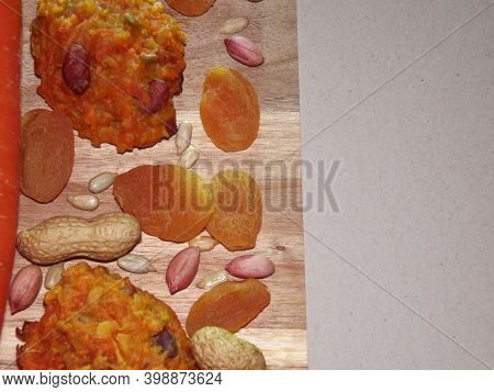 Carrot Diet Cookies With Carrots, Dried Apricots, Peanuts And Sunflower Seeds With Space For Text. H
