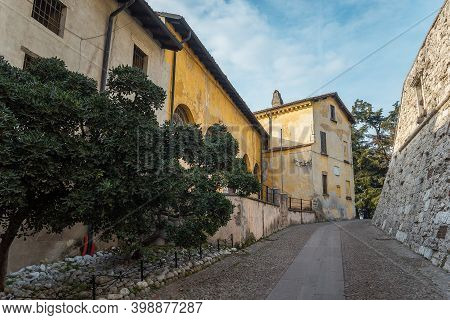 Brescia, Italy - December, 2015: The Castle Of The City Of Brescia On A Sunny Clear Day Against A Br
