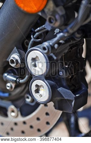 Macro Shoot Of Modern Motorcycle Front Brake System Pistons. Vertical Image Orientation
