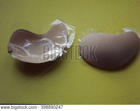Beige Strapless Bra Close-up On Different Color Backgrounds, Size A. High Quality Photo