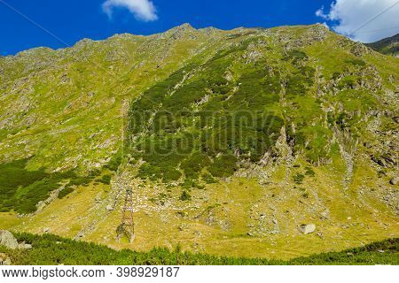 Majestic Landscape Of Summer Mountains. View Of Hills In Rays Of Sunlight. Fagaras. Amaizing View On