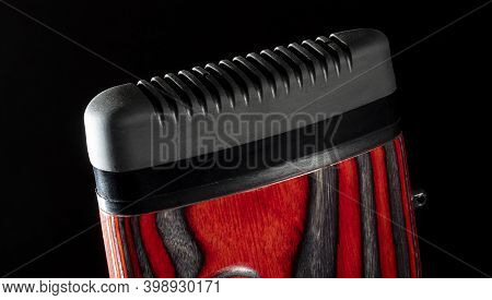 Rifle Recoil Pad Attached To A Red And Black Gun With A Black Background