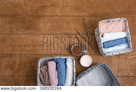 A Group Of Organic Cotton Clothing Laid Out On A Wooden Background Is Ready To Be Folded Into White 