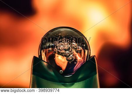Fireball. The Ball Is A Sphere With The Fire Of The Flame Reflected In It. The Magic Ball Is On Fire