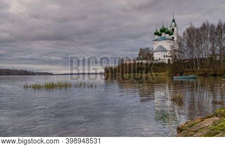 Church Of The Holy Trinity In The Village Of Dievo Gorodishche. Early Gloomy Morning On The Bank Of 